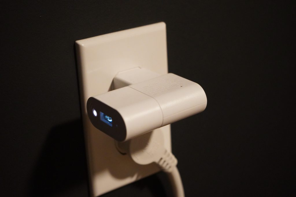 IKEA shortcut button mounted above a toilet paper holder.