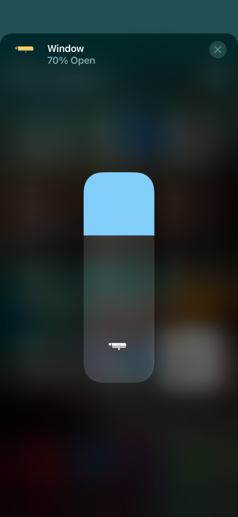 Phone interface with a vertical slider for adjusting a smart-home device.