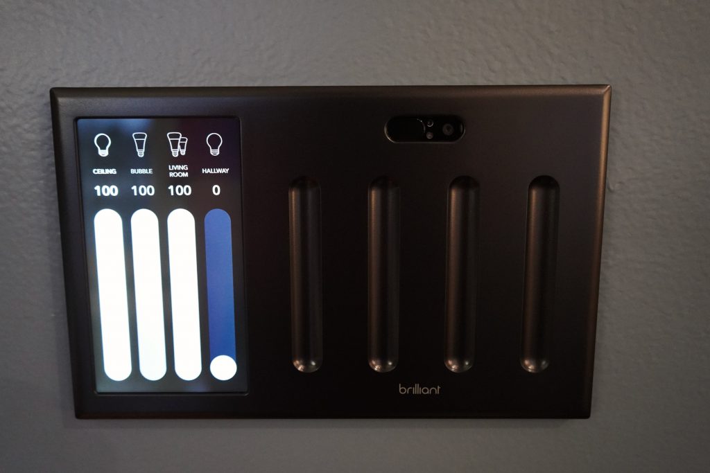 Brilliant touchscreen showing vertical lighting sliders.