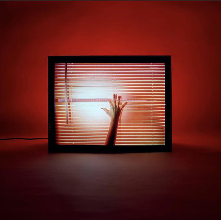 CHVRCHES’ Screen Violence album cover, with a framed image lit in red.